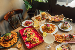 Delicious pub food served at House of Hammerton, laid out on a rustic table ready to share.